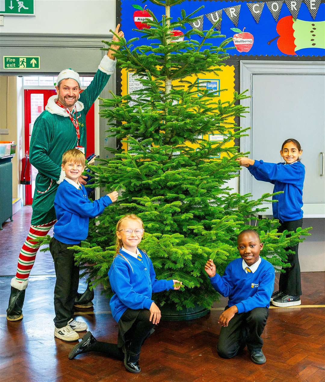 Dave Wheatley of Petite Peonies and children at Eastgate Academy. Picture: Ian Burt