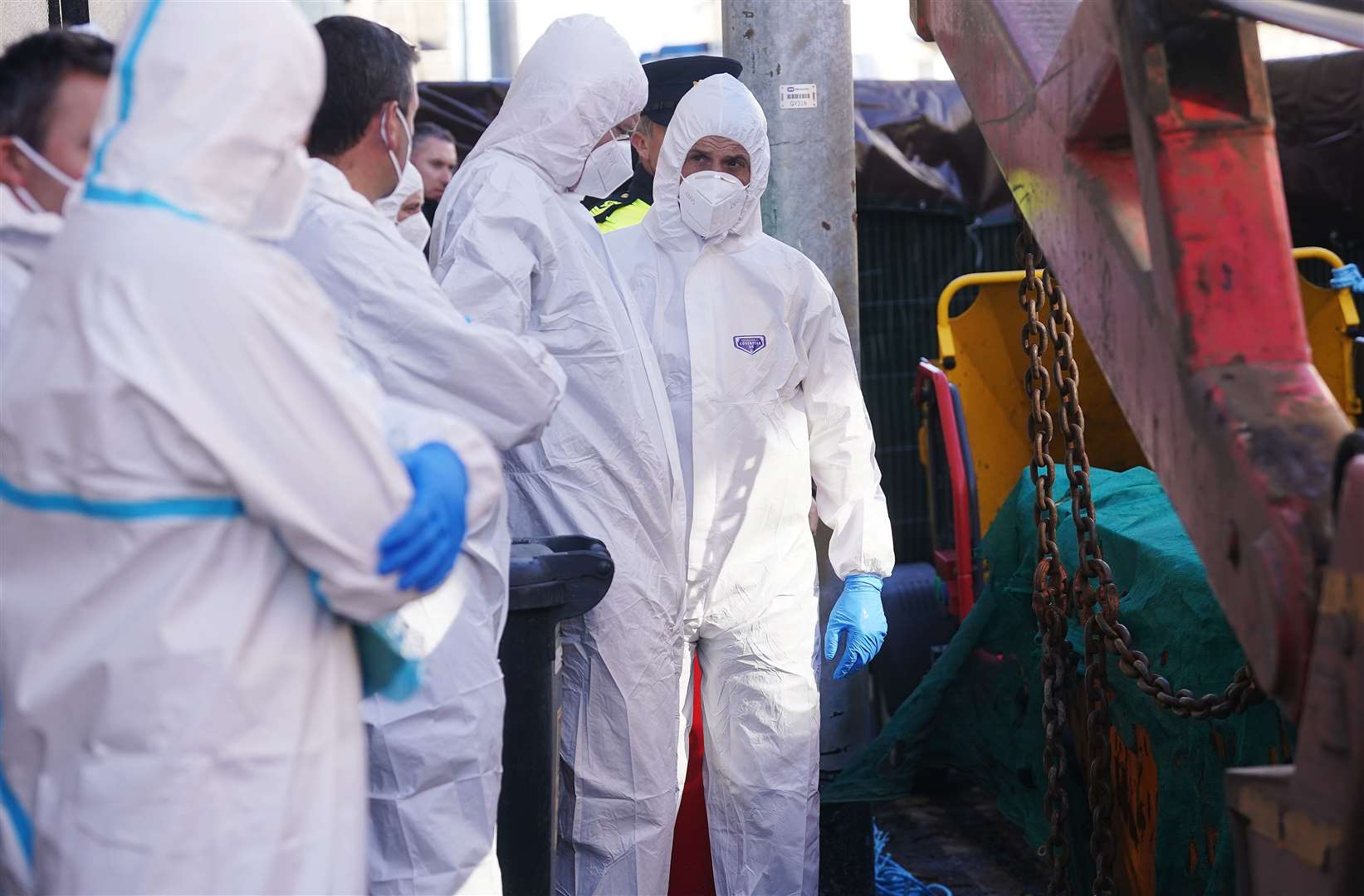 Garda forensics officers at the property in Youghal (Brian Lawless/PA)