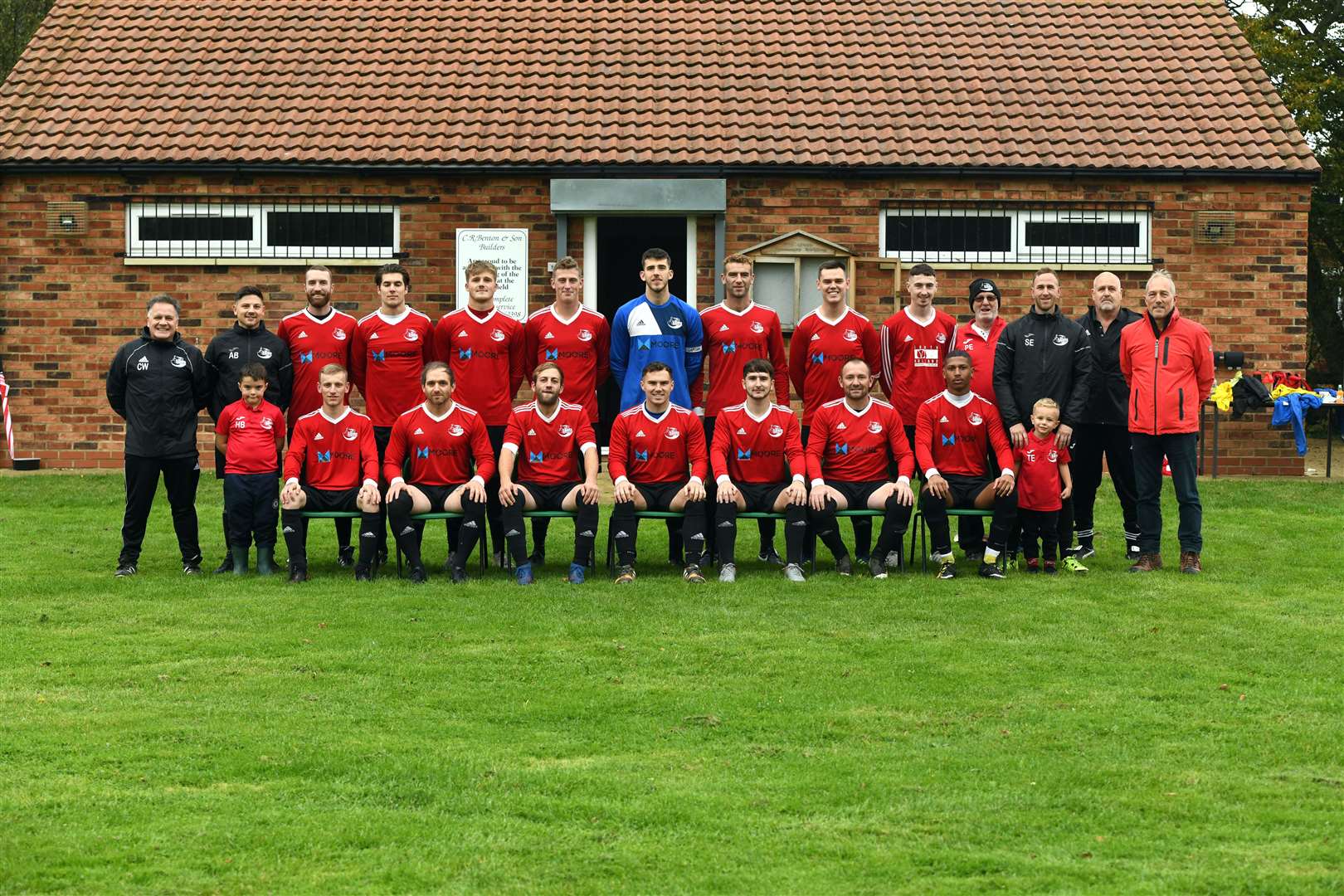 Tydd FC, from right (back): secretary Carl Wilson, co-manager Alan Burch, Chris Yaxley, Maxwell Burrell, Jamie Mills, Ryan Ingle, captain Harry Ford, Jake Mason, Timothy Magnus, Jordan Clow, kit man Phil Easey, co-manager Stuart Easey, coach Marcus Burrell, chairman Mark Benton, (front) mascot Harry Burch, Brandon Harker, Matthew Clayden, Daniel Griffith, Bradley Easey, Dominic Easey, Scott Pemberton, Jamal Nyang and mascot Theo Easey.