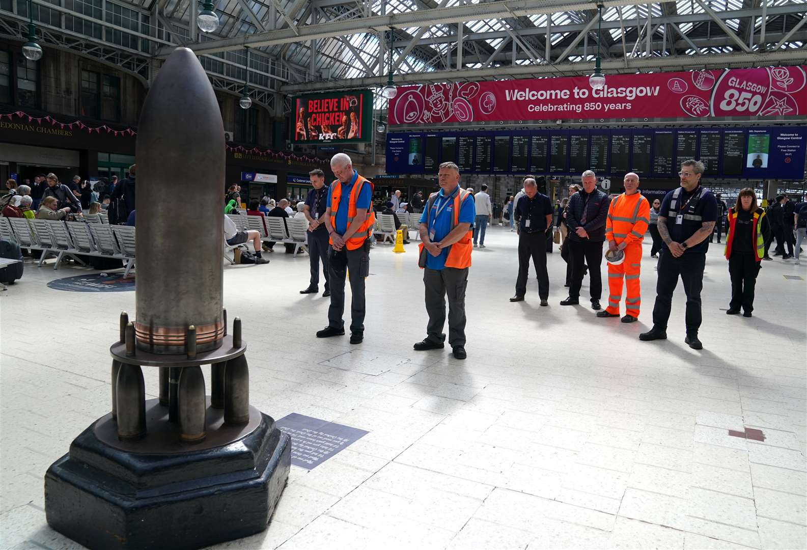 People observe a two-minute silence at Glasgow Central Station (Andrew Milligan/PA)