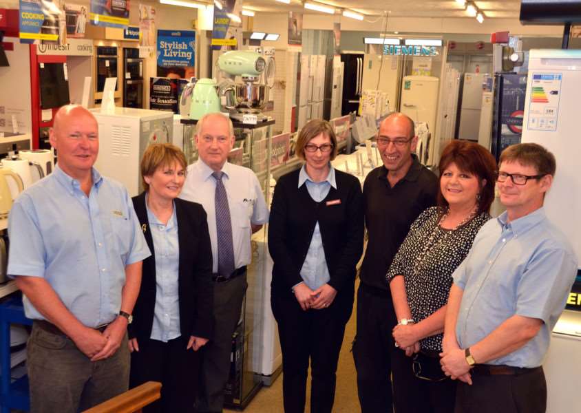 PLATINUM PLEDGE-R: The staff of Pledgers (Euronics) Ltd, Long Sutton's oldest established retailer are (from left) Graham Smith, Gill and Genek Wysoczananski, Anna Hughes, Bob Tointon, Marion Mitchell and Peter Cook. Photo by Tim Wilson. SG060617-140TW.