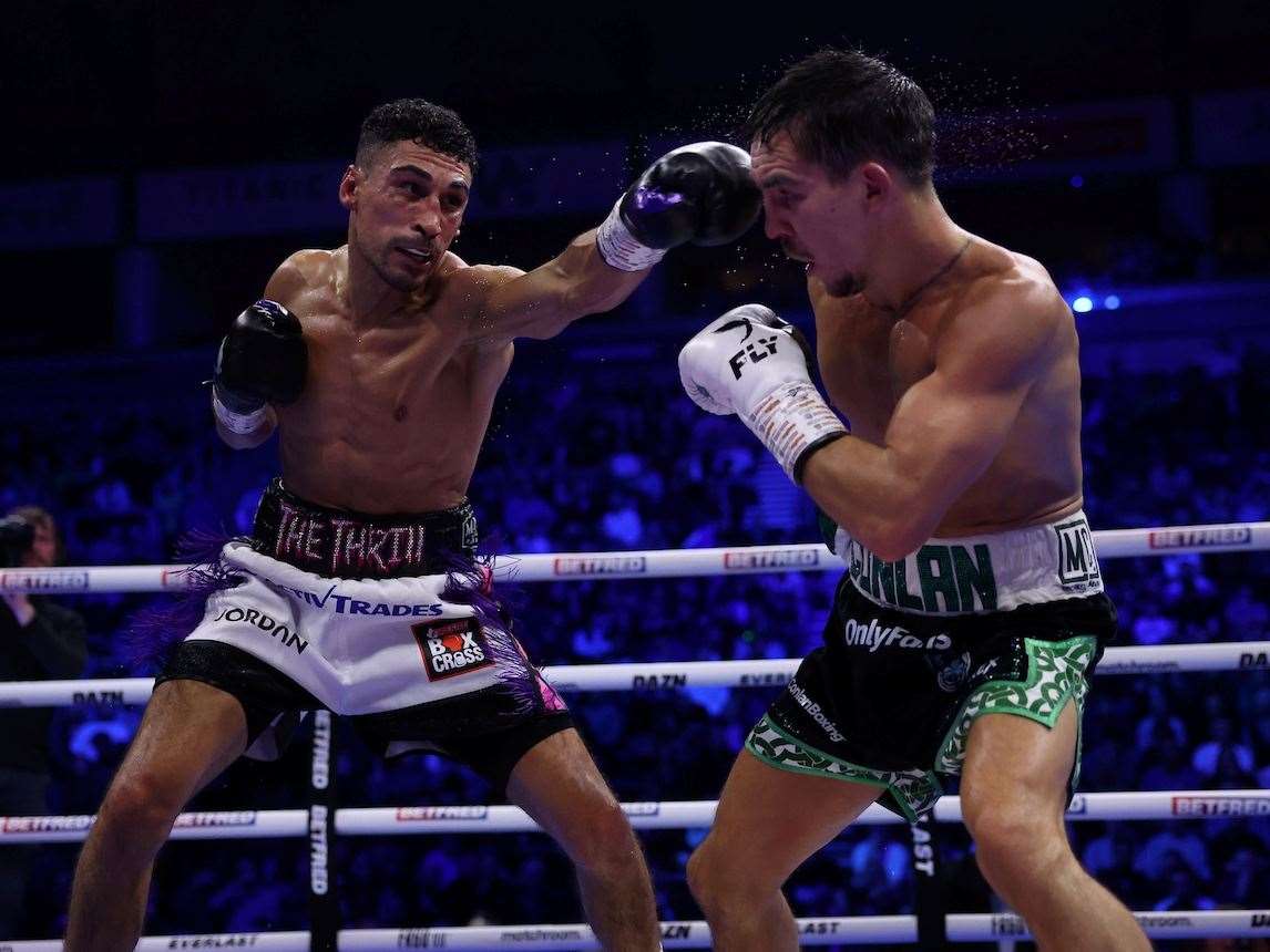 Jordan Gill lands a punch on Michael Conlan. Picture: Mark Robinson (Matchroom Boxing)