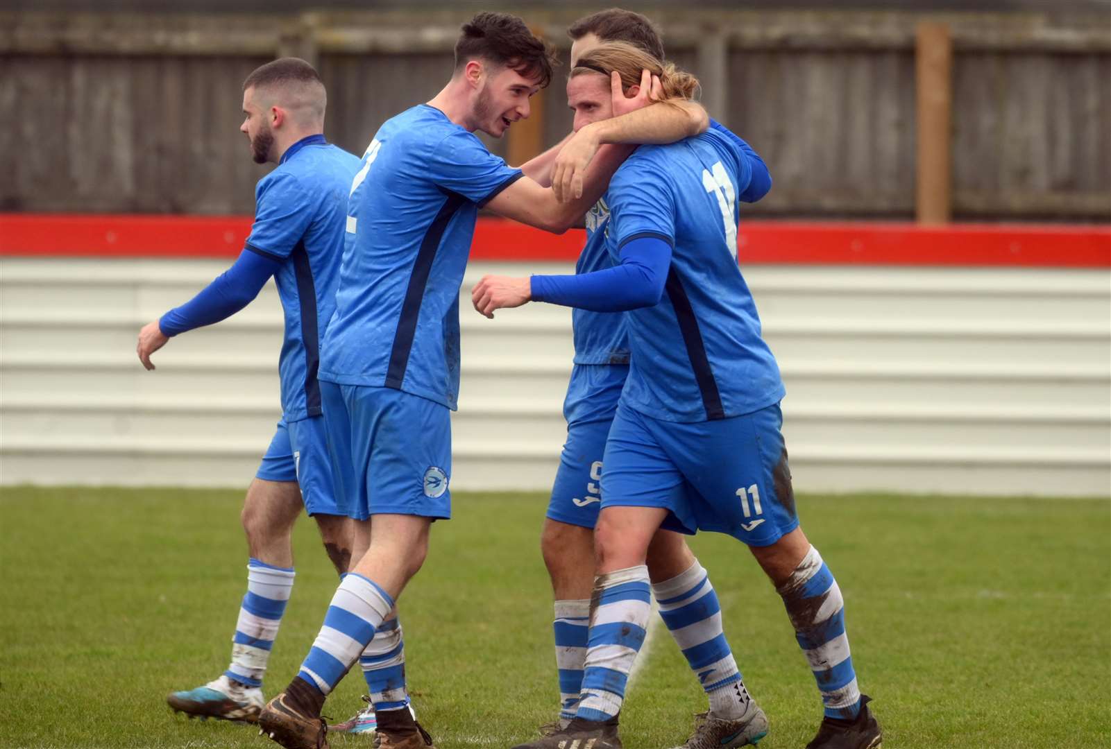 Jack Brand is congratulated after scoring for Outwell Swifts