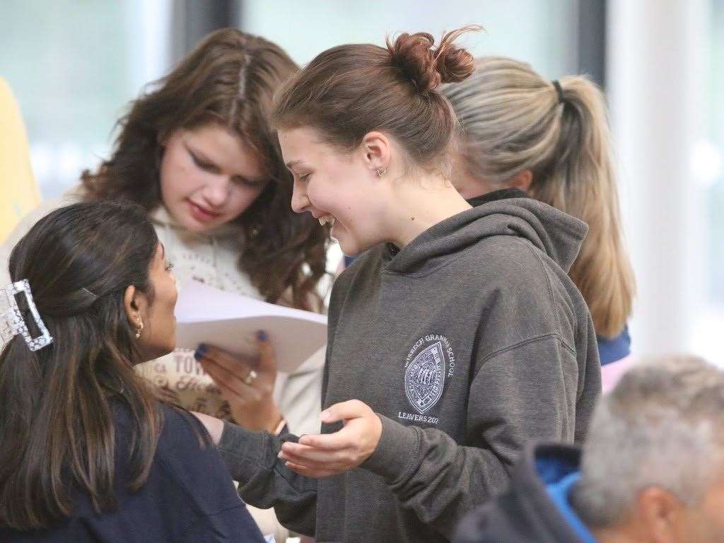 Smiles as this student at Wisbech Grammar School checks her results.
