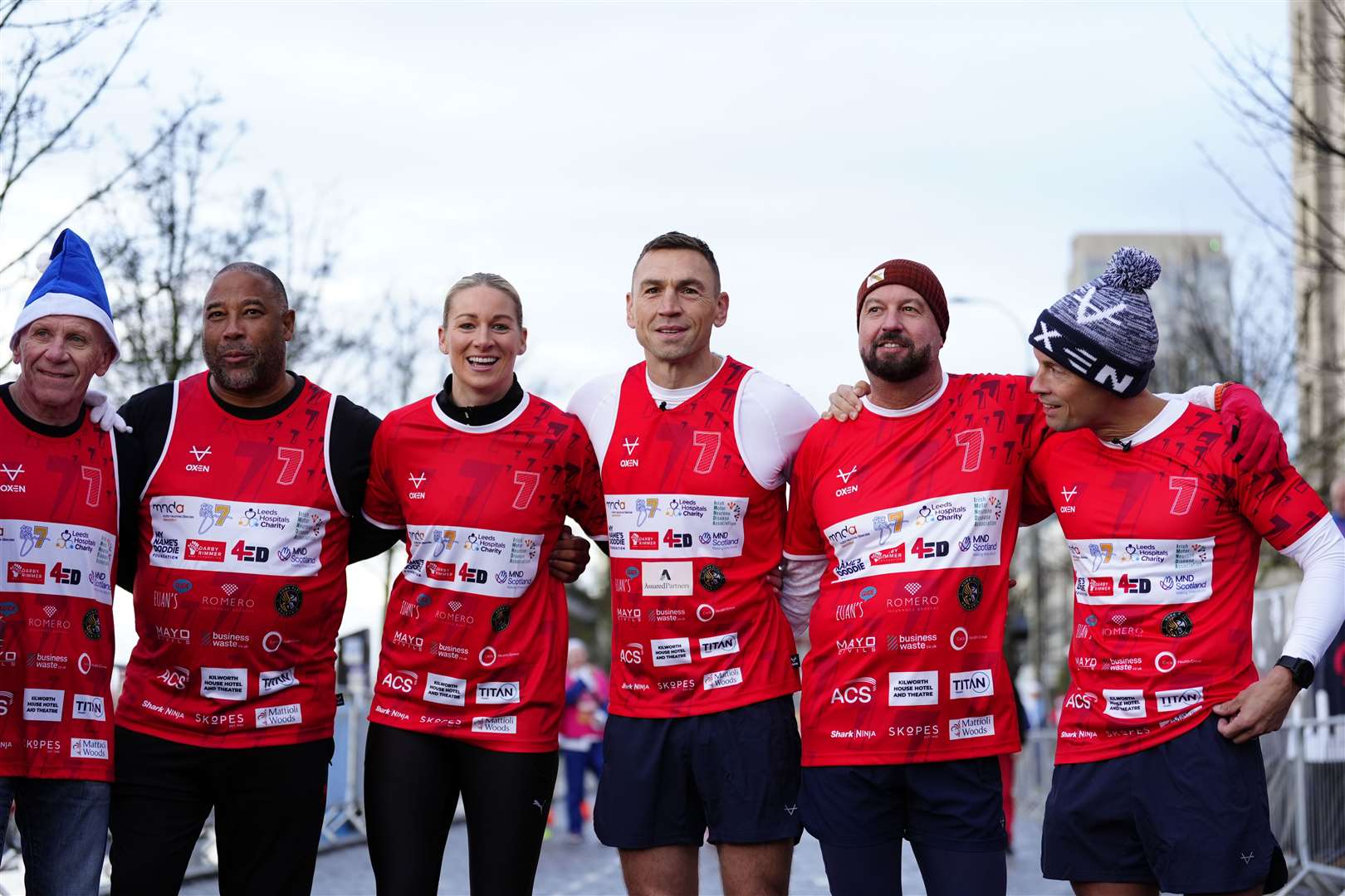 Kevin Sinfield (third right) with Peter Reid (left), John Barnes (second left), Liverpool FC Ladies Gemma Bonner, with his two support runners, before he starts his latest fundraising challenge (Peter Byrne/PA)