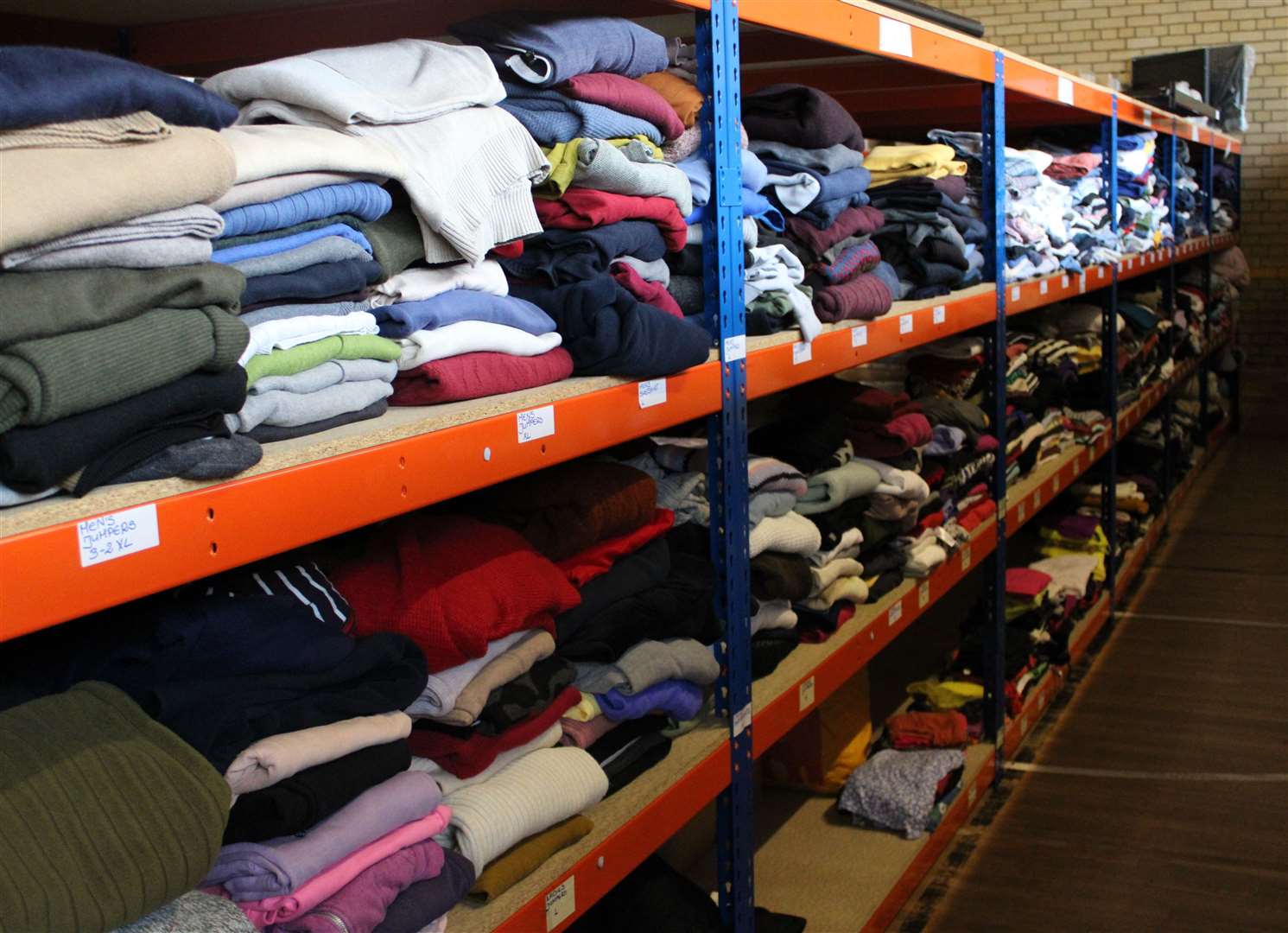 The Ferry Project's Donation Hub is full of clothing for those in need.