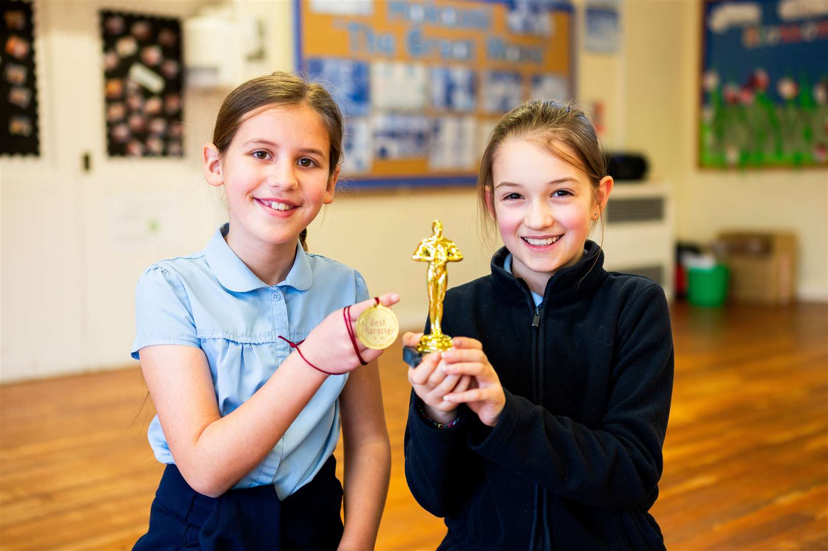 Happy winners with their trophies.