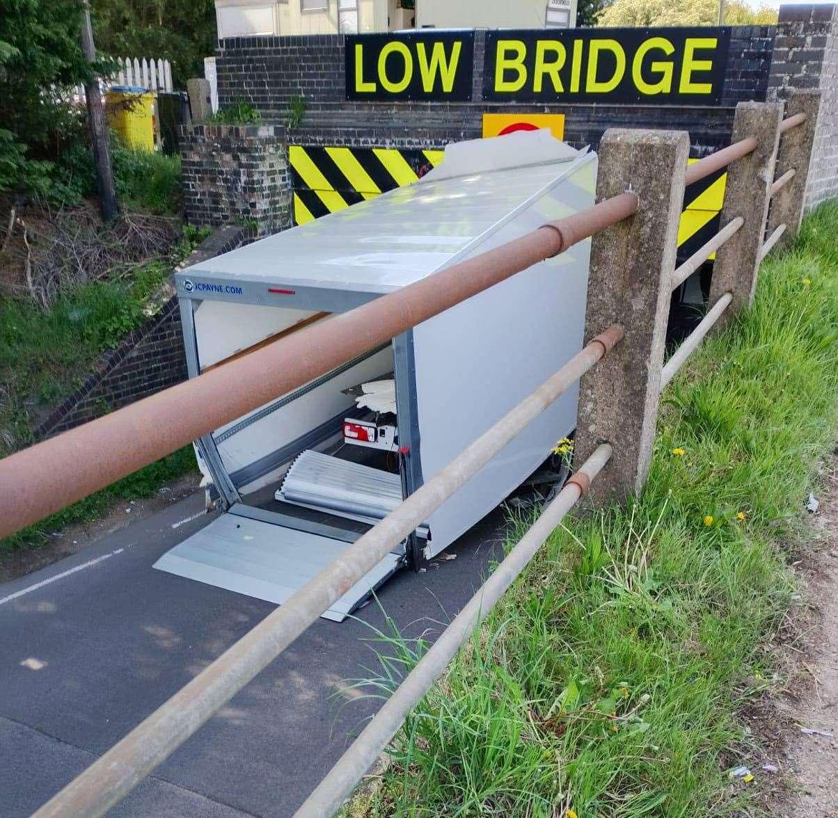 A van was left stuck under Stonea bridge after crashing into it
