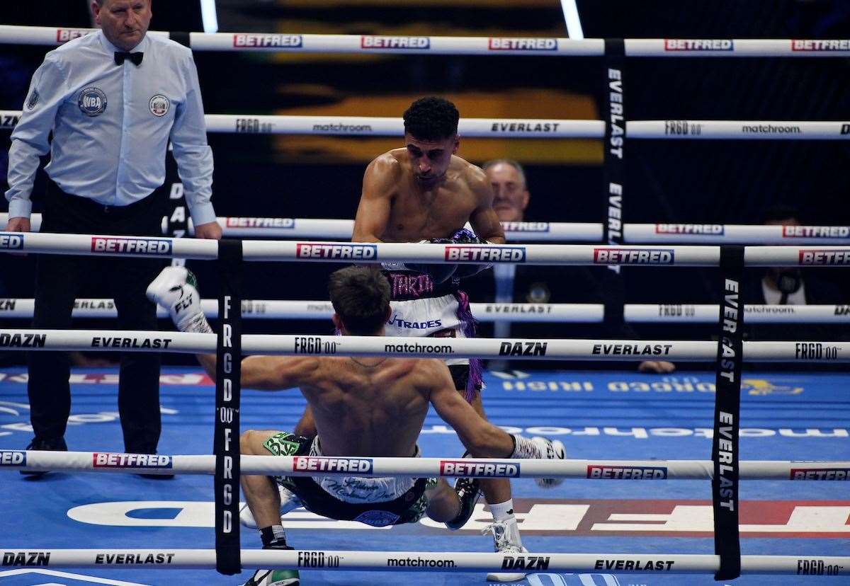 Jordan Gill knocks down Michael Conlan in Round Two. Picture: Matthew Pover (Matchroom Boxing)