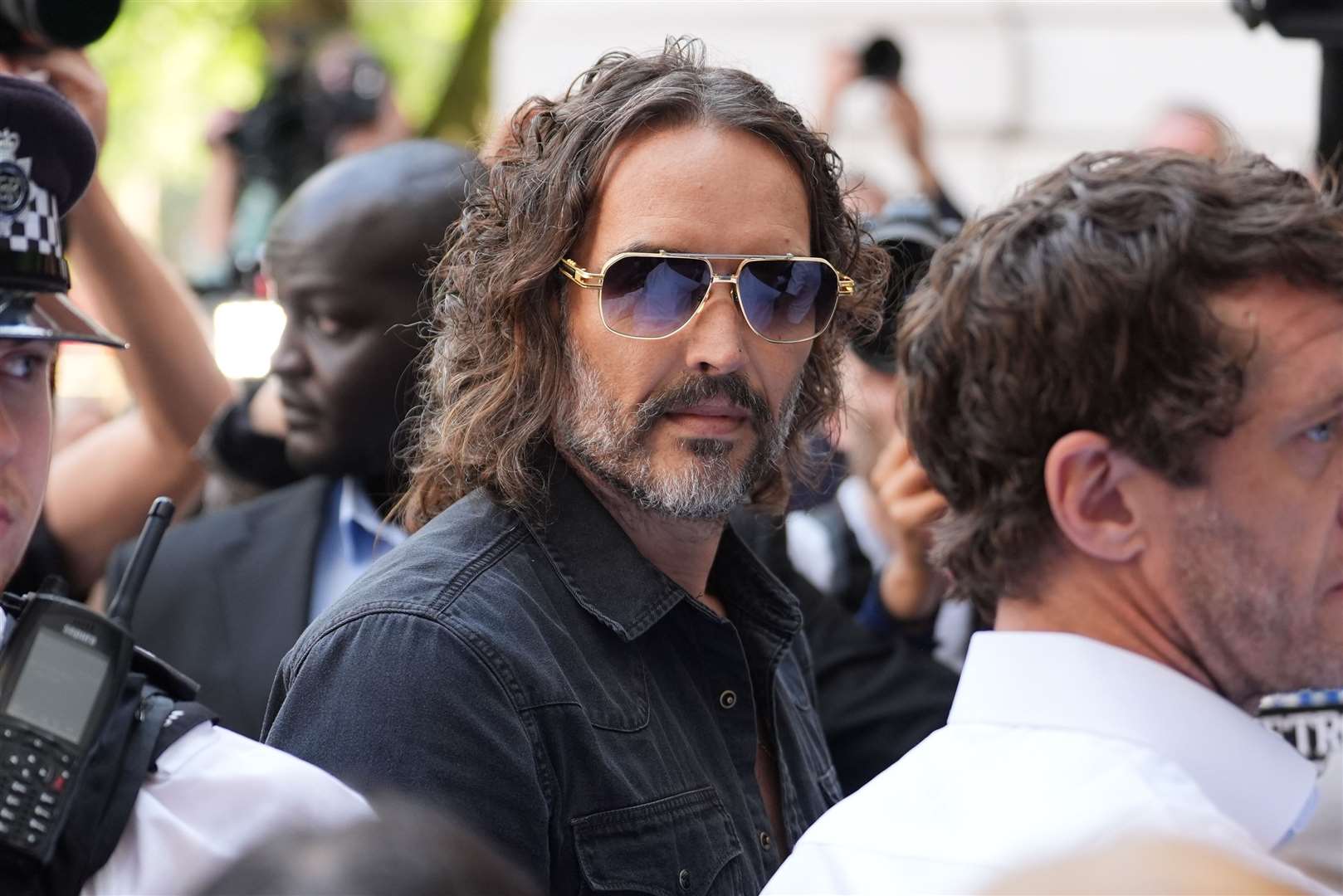 Russell Brand arriving at Westminster Magistrates’ Court (Lucy North/PA)
