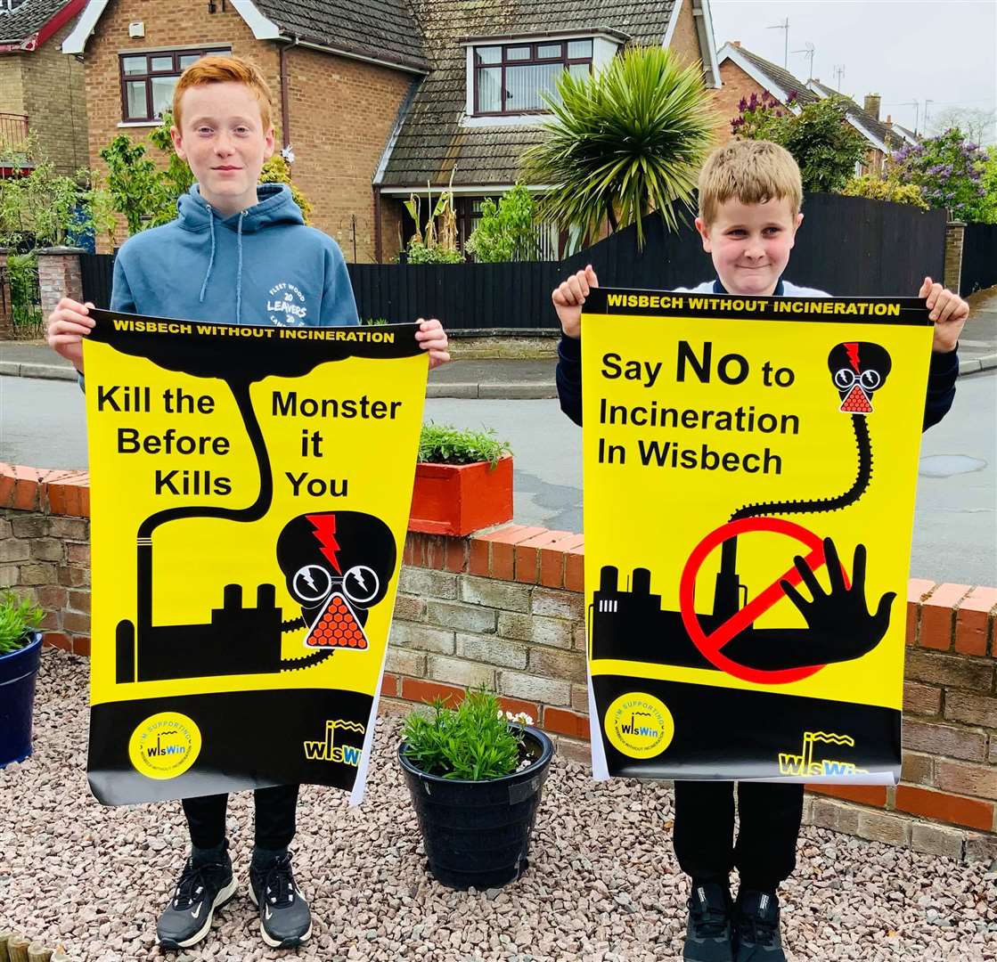 Young protestors with some of the campaign posters that people can have for their homes and businesses. (47845548)