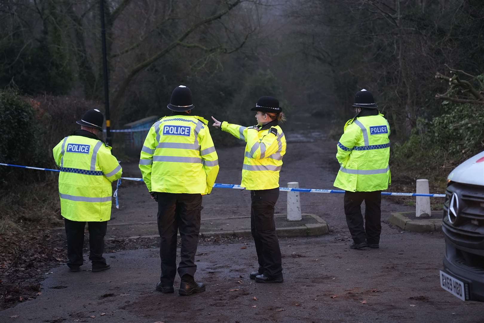 Police officers at the scene a day after Leo Ross’s death (Jacob King/PA)