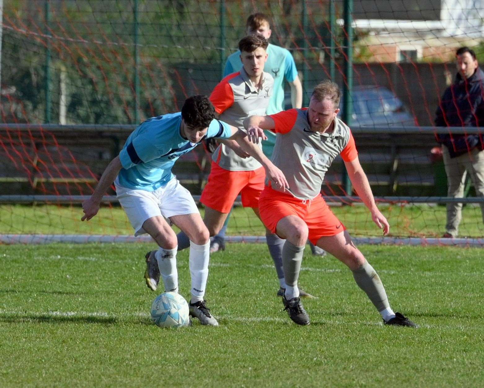 Parson Drove (grey and orange) v Holland (blue). Dean Miller
