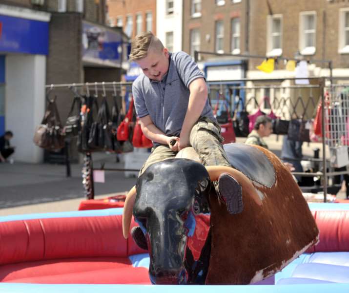 Lewis Taylor 11 having a go on the bucking bronco at the Country and Western Themed Market ANL-150518-063653009