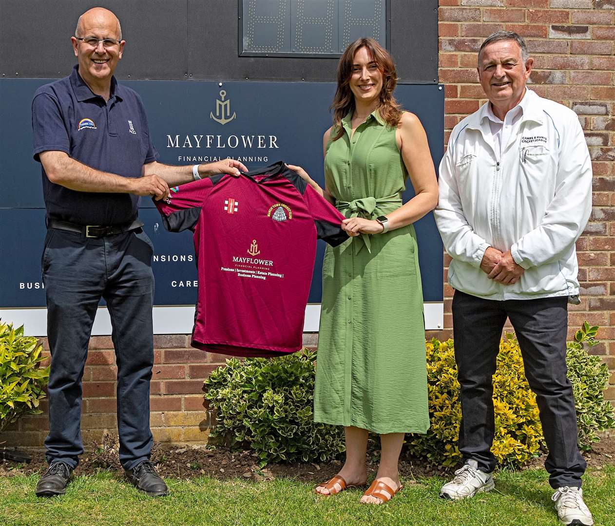 March Town Cricket Club chairman and scorer Ian Liversedge with Ashlie Barnard of main club sponsor Mayflower Financial Planning and club secretary and umpire Les Mills