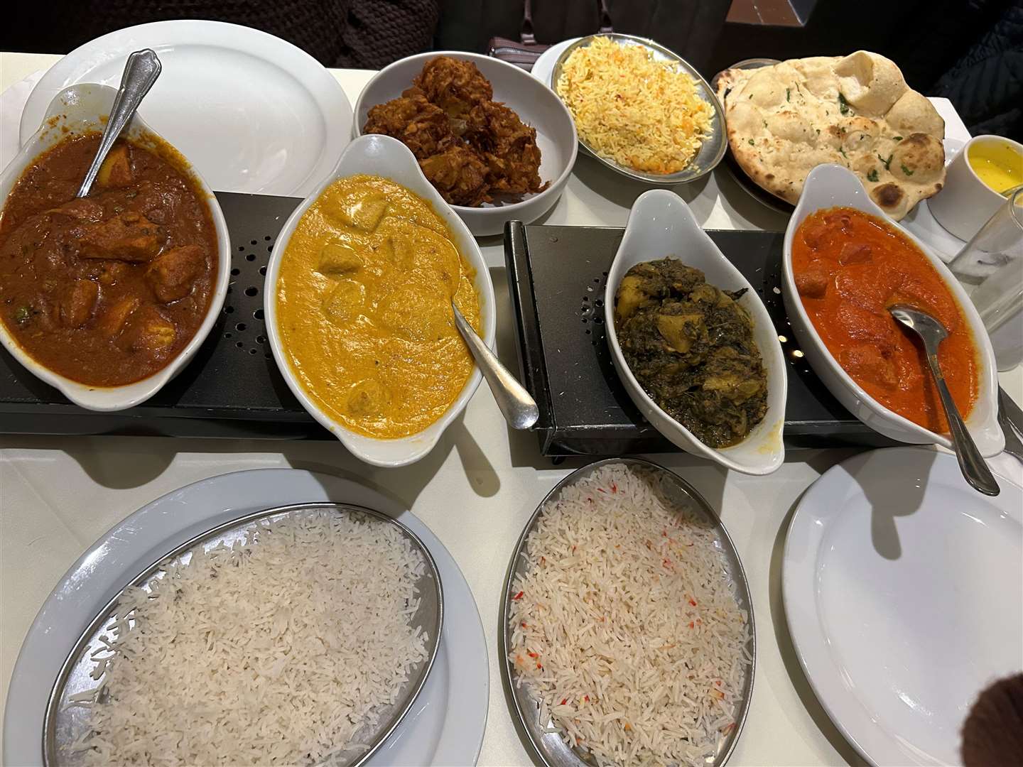 Our food set out on the table on hot plates