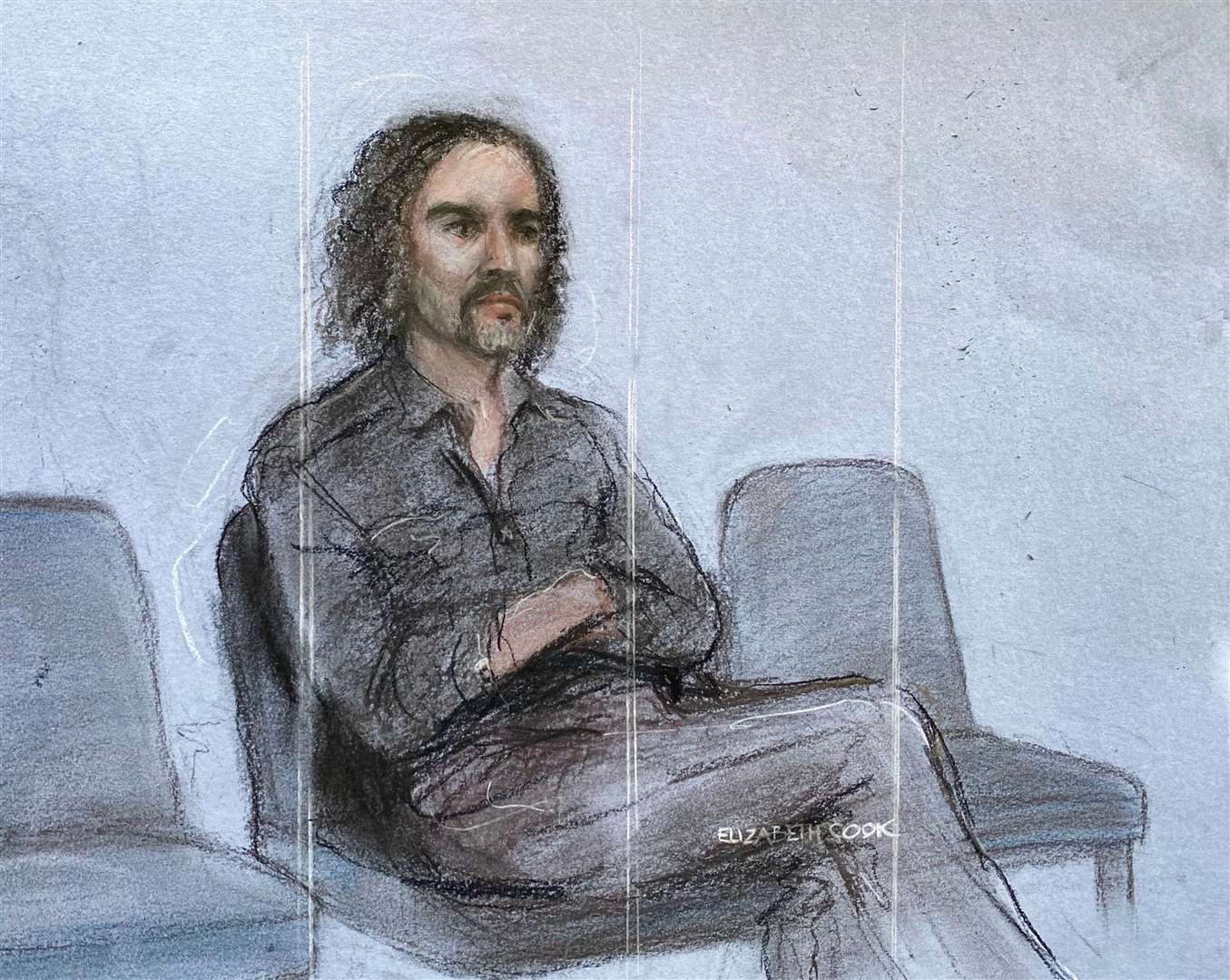 Court artist sketch of Russell Brand appearing in the dock (Elizabeth Cook/PA)