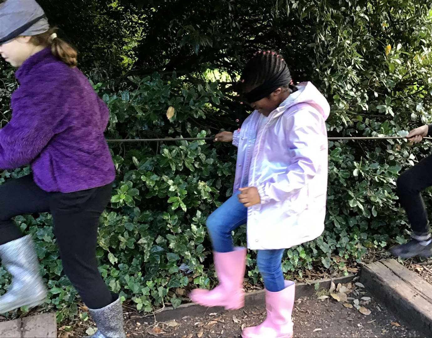Children tried a variety of activities including wearing a blindfold.