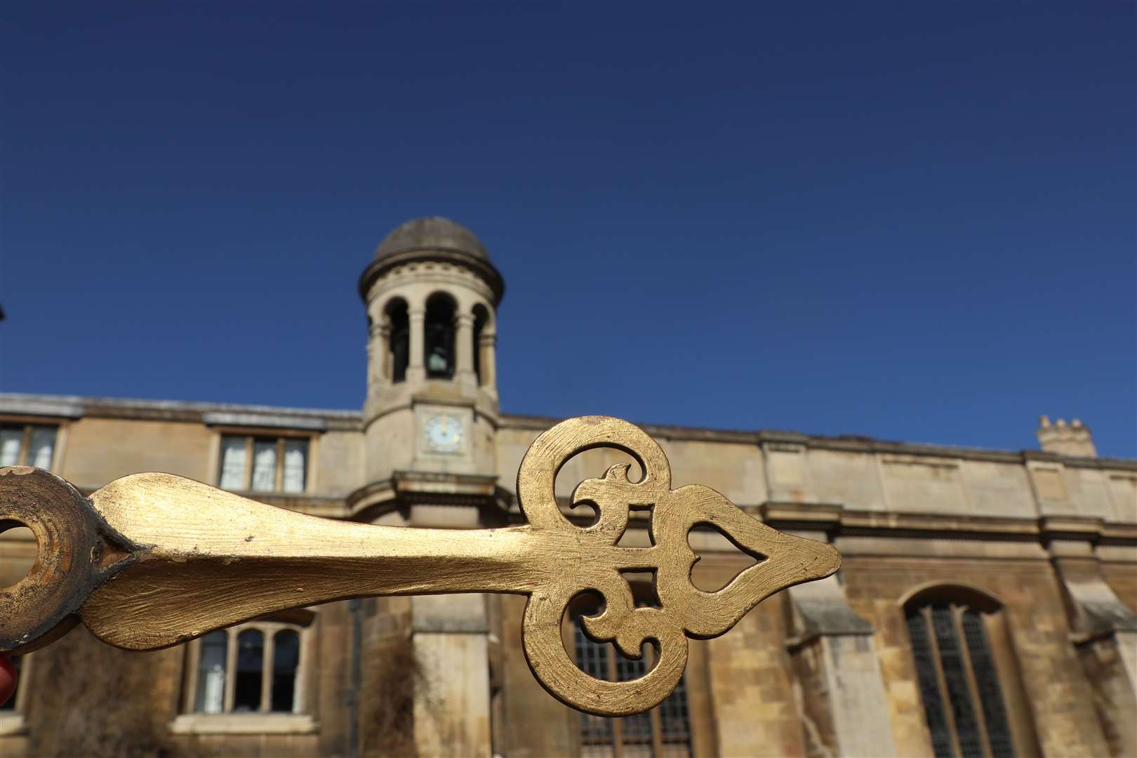 The missing hour hand of the chapel clock at Gonville and Caius College has been returned around 100 years after it was taken in a student prank (Gonville and Caius College/PA)