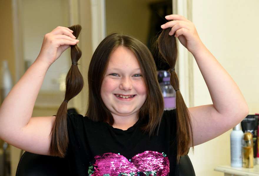 Kelsey Allington 10 having her hair cut for national autistic society and has raisied �250 and hair to Little Princess Trust