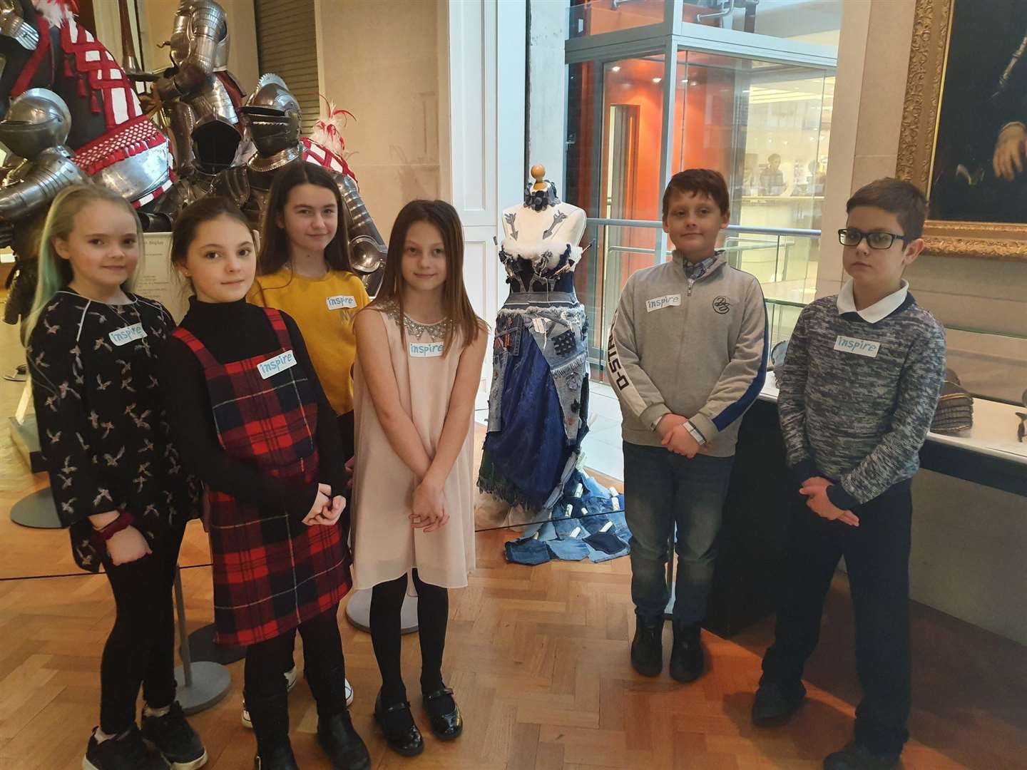 Children from St Peter's School with the dress they designed and made on display at the Fitzwilliam Museum. (24362012)