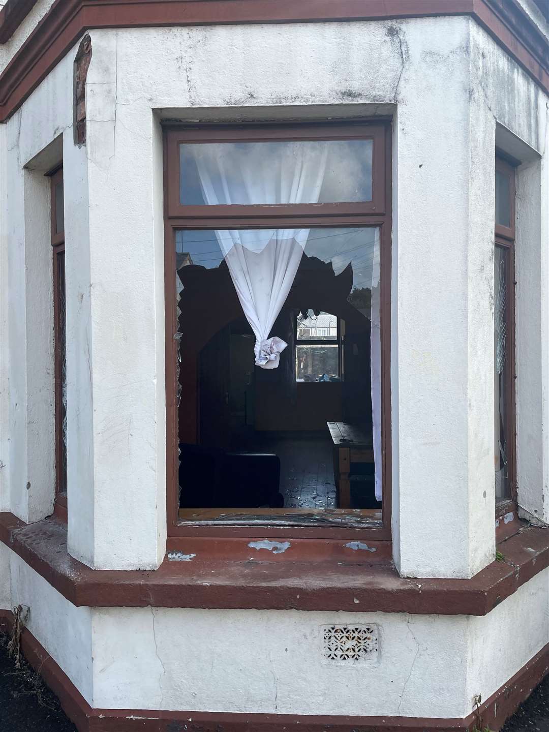 A broken window after serious disorder broke out on Monday night in Ballymena (Jonathan McCambridge/PA)