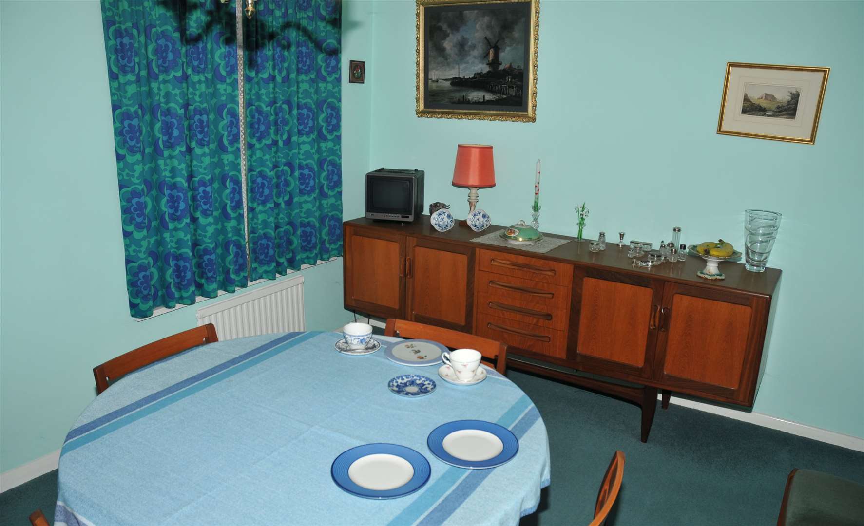 Una's dining table was set out for two people in a messy manner