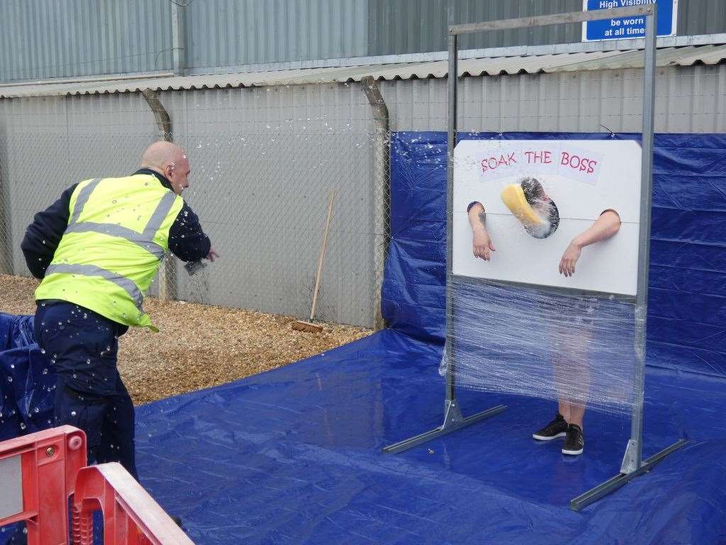 Senior staff at DHL in Wisbech got a soaking from employees for charity. (15437889)