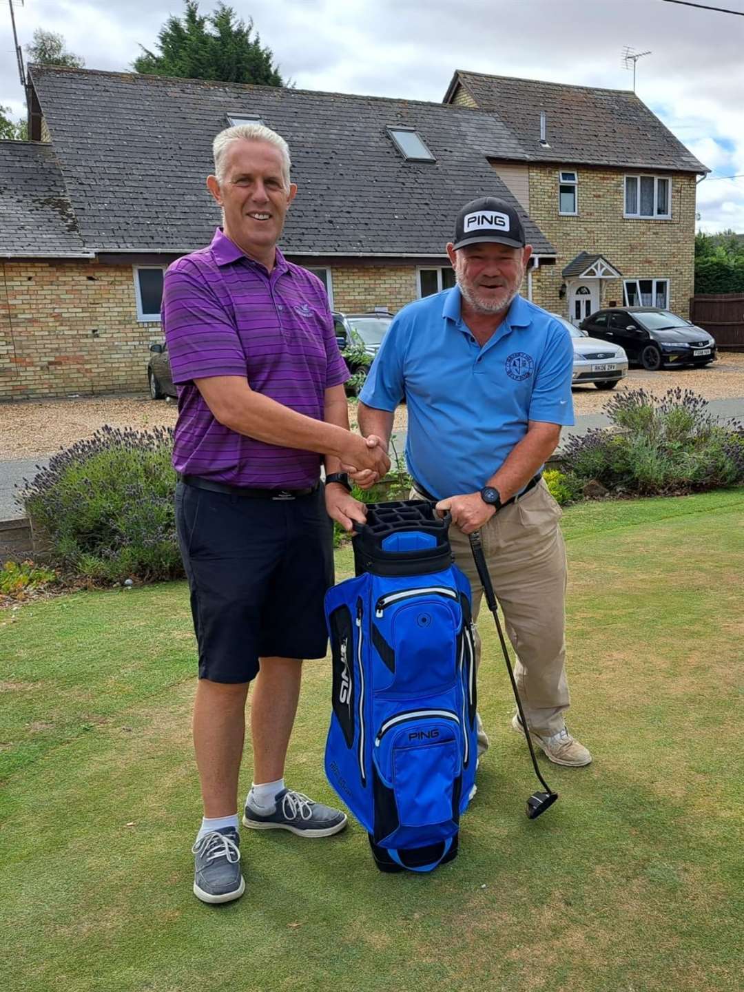Steve Steels receives his prize from club captain Steve Sayer (58212938)