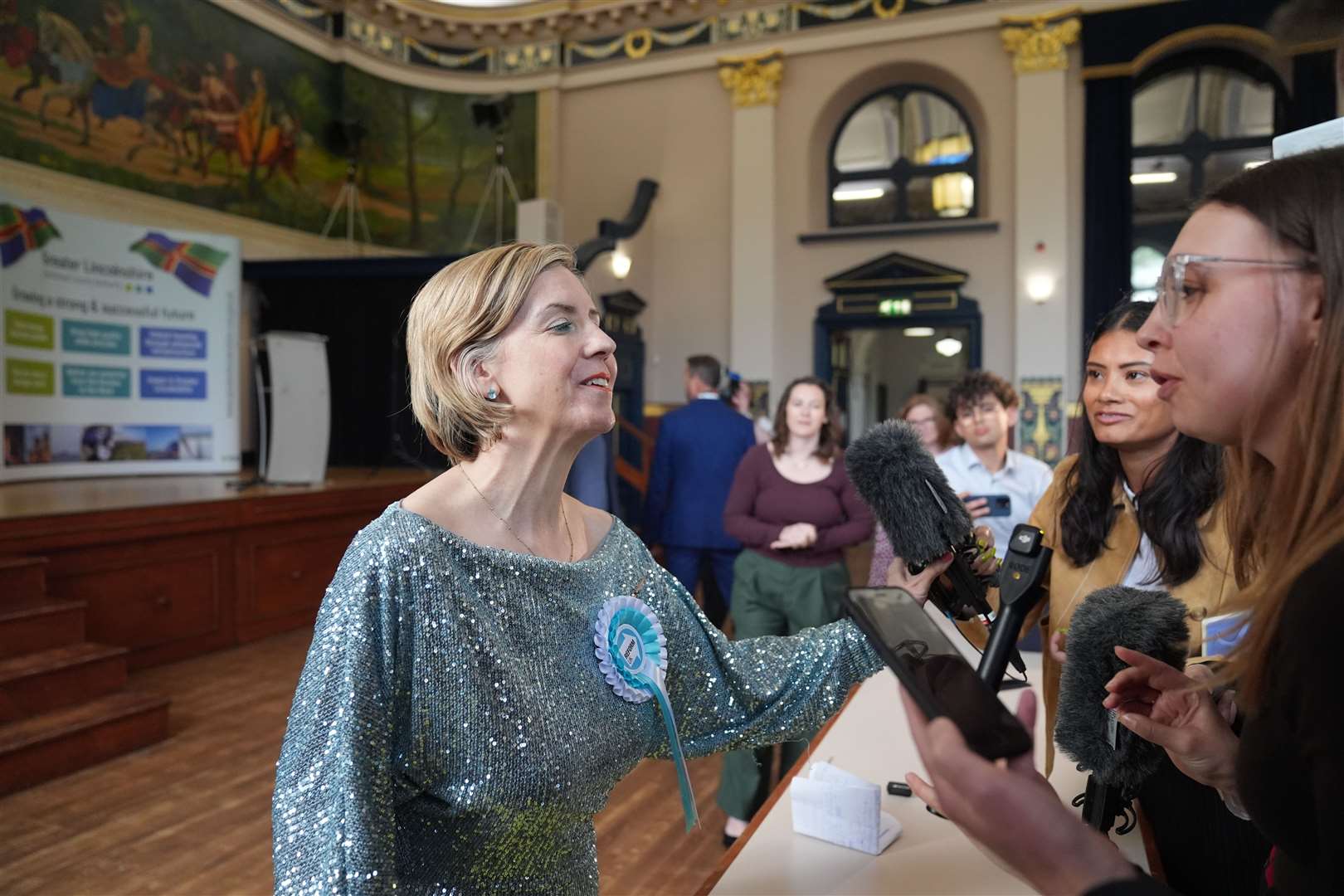 Reform UK candidate Dame Andrea Jenkyns pushes away a journalist’s microphone whilst speaking to the media after winning the election for Greater Lincolnshire Mayor (Joe Giddens/PA)