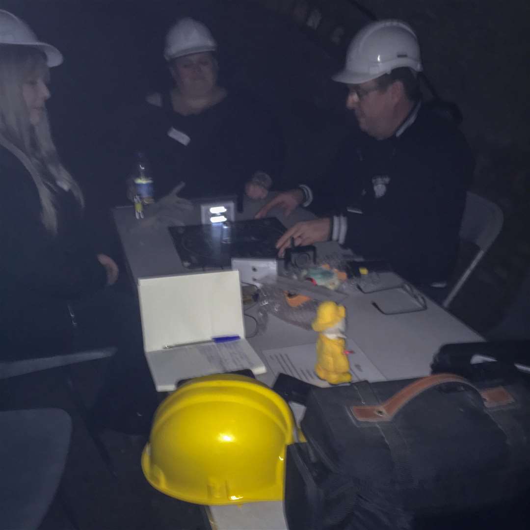 Trying to make contact with spirits in the castle vaults. (6821759)