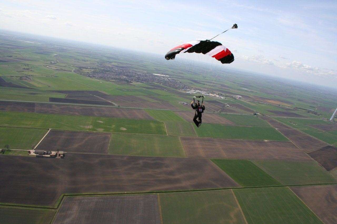 A parachutist drops over the North London Skydiving Centre at Block Fen. Photo: North London Skydiving Centre.