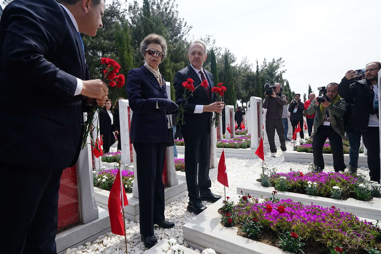 The Princess Royal with Gokhan Yazgi, Turkey’s deputy minister for culture, laying red carnations at the graves of Turkish soldiers at Canakkale Martyrs’ Memorial in the Gallipoli Peninsula Historical National Park (Yui Mok/PA)