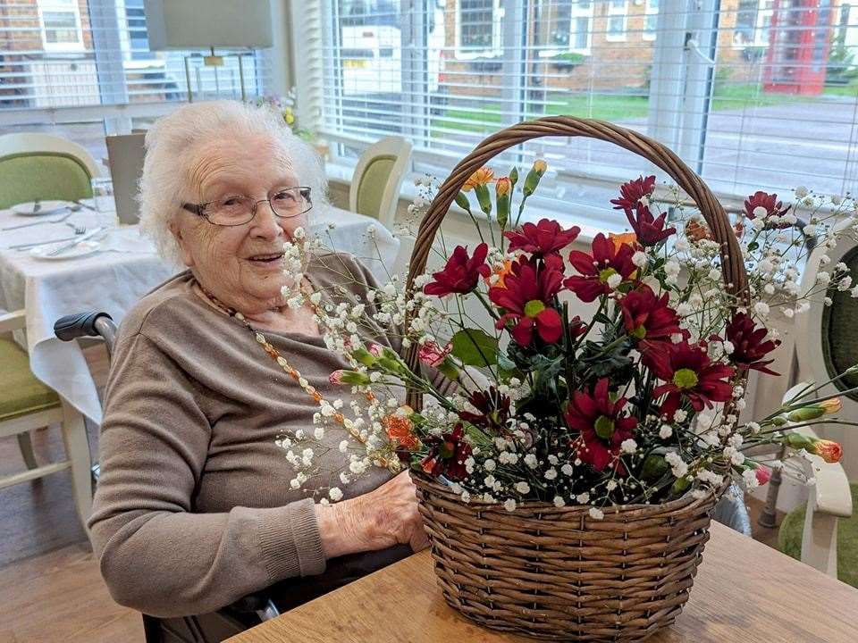 Residents with their floral decorations