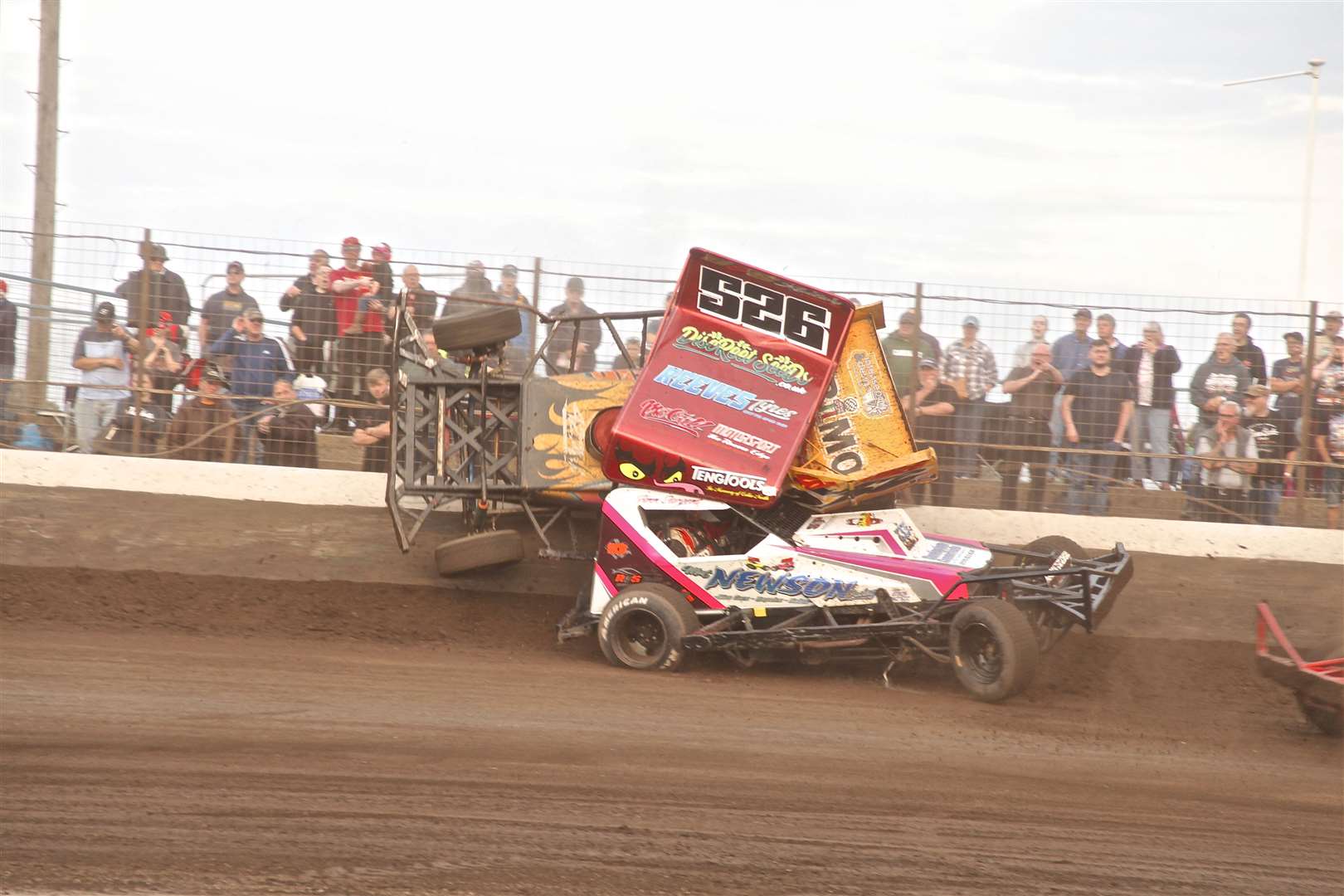The crash left Kitson's car pinned against the fence.