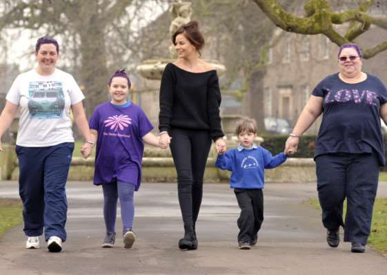 left to right Nicky Green, Rosie Green, Harriet Bates (Images Hairdressers(, Albert Saddler and Beverley Green.'3 of them have had their hair dyed purple to raise awareness of epilepsy ANL-150318-150032009