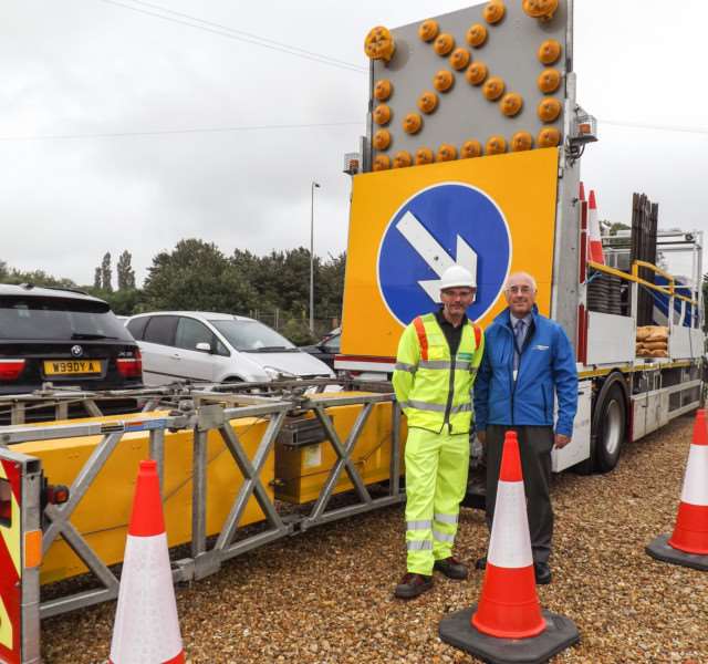 Highways England East team were in Guyhirn talking about �20million worth of resurfacing and safety schemes along the A47 including at Guyhirn and Wisbech. They brought along one of their trucks to explain how it works to protect road workers. Pictured: Ian Jobson, of Highways England and Steve Harris, a road worker with Martin based at Thorney.