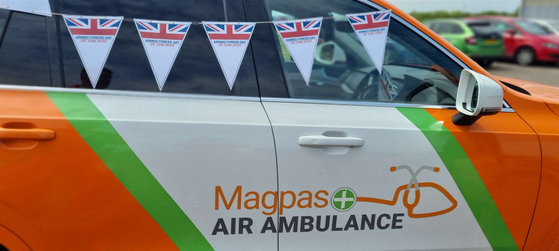 Magpas Air Ambulance medics, CCP Andy Smith and Dr Rupert Hurry (both part of the Armed Forces community), with a charity rapid response vehicle and Armed Forces Day bunting . (57526018)
