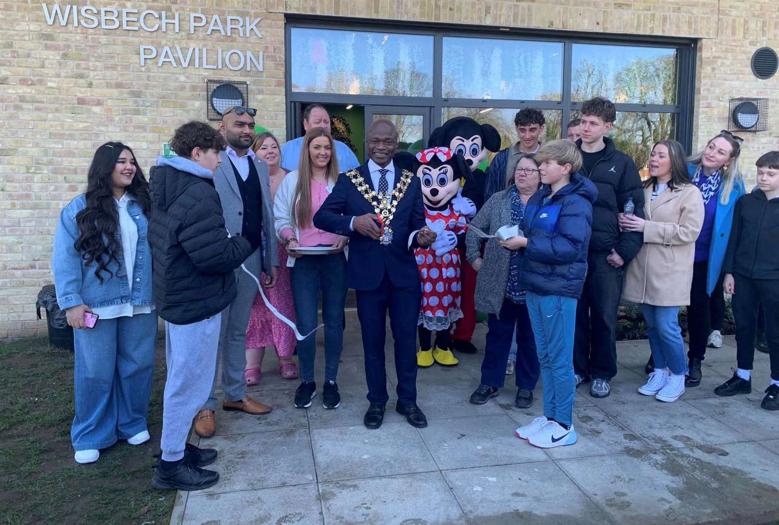 Wisbech mayor Sidney Imafidon cuts the ribbon to open the new cafe in Wisbech park