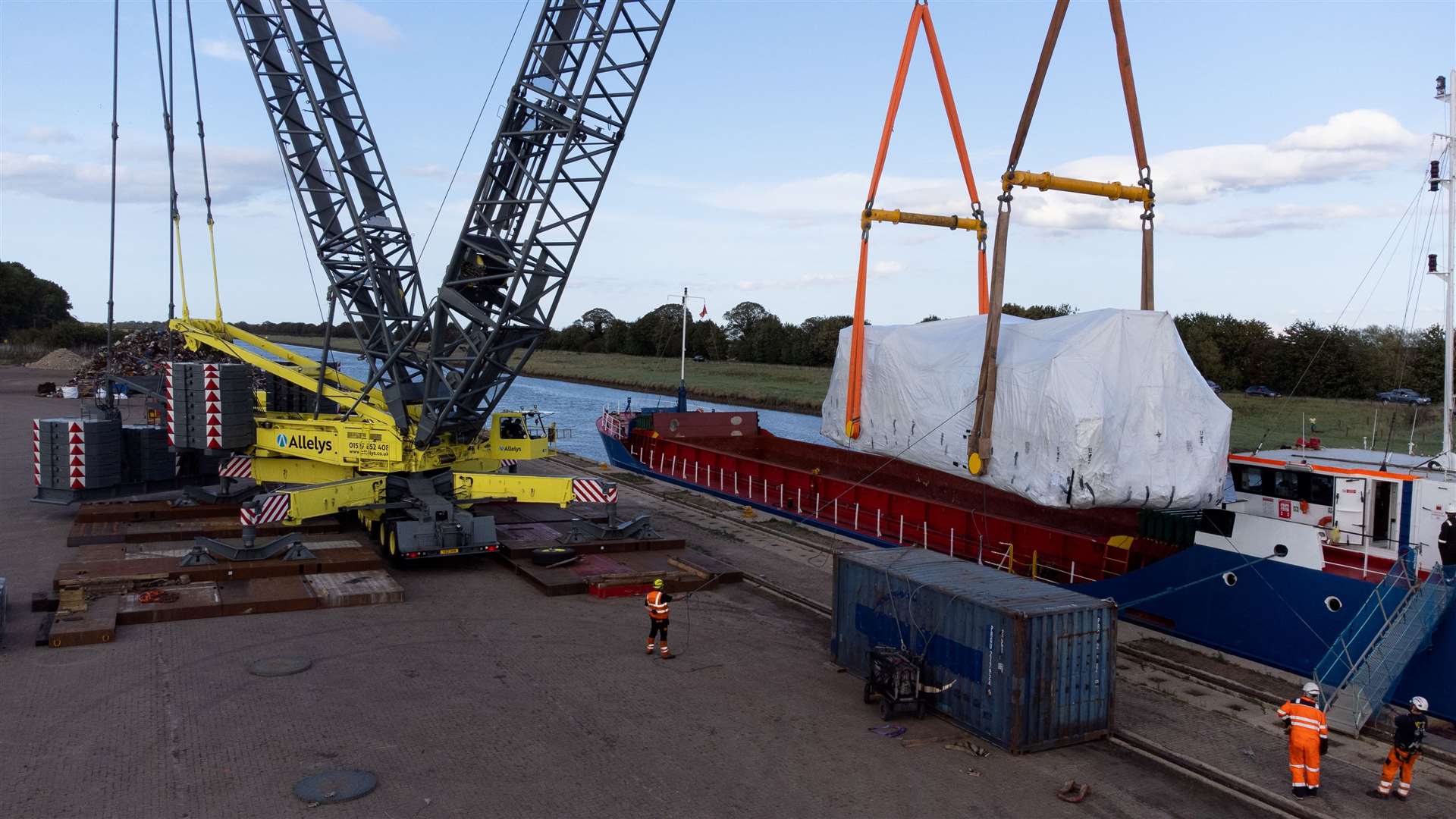 The turbine is lifted by crane on to the ship at Port Sutton Bridge