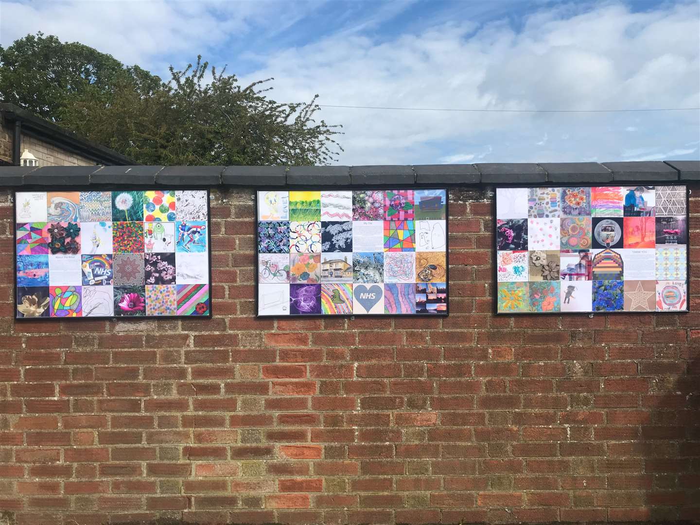 The tiles are now on display outside the village pub.