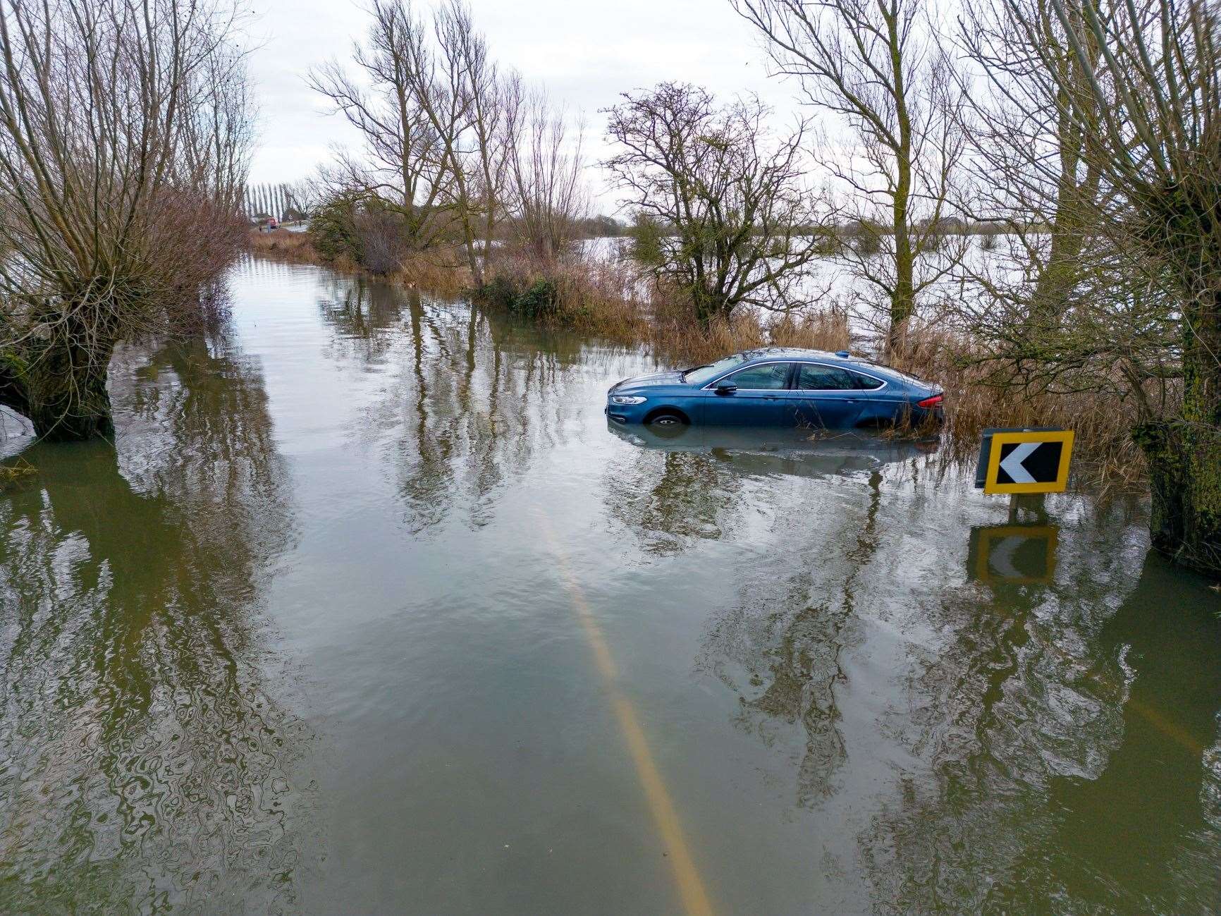 Car stuck in the flood water at Welney Causeway. Picture: Ian Burt