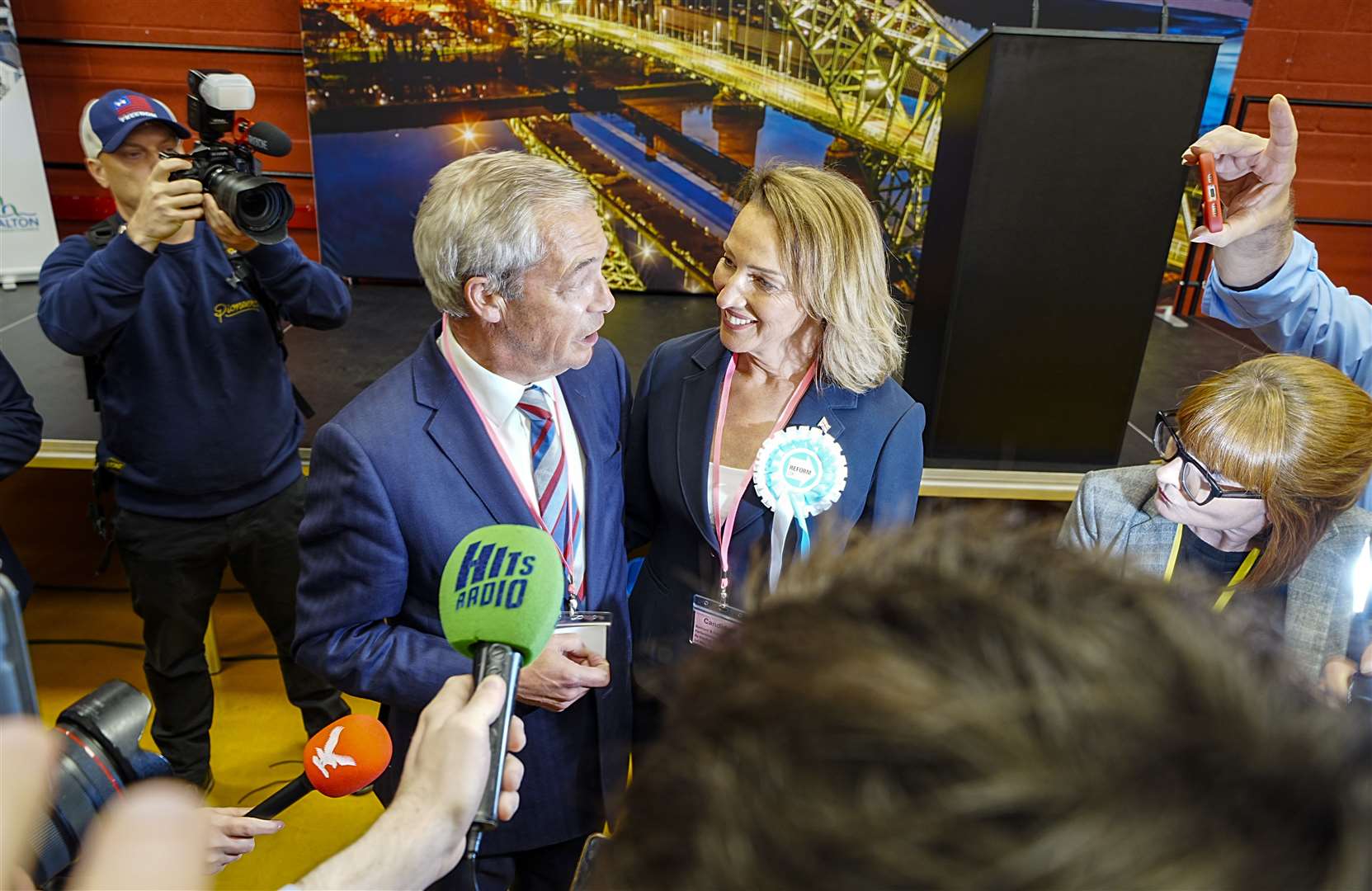 Sarah Pochin and Nigel Farage talking to the media after Reform UK’s six-vote win over Labour in the by-election (Peter Byrne/PA)
