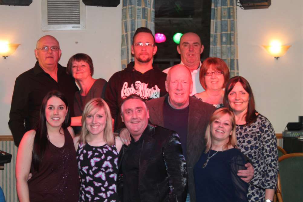Family members and friends with Katie Perry, front left, who held a cabaret fundraiser in Chatteris in aid of Alzheimer's Society. ANL-150326-093214001