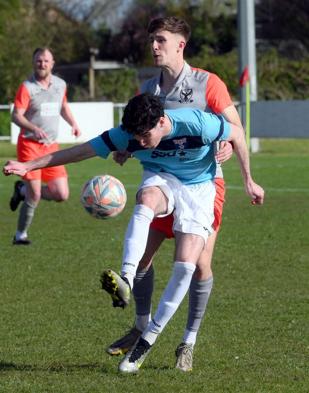 Parson Drove (grey and orange) v Holland (blue). Luke Crombie