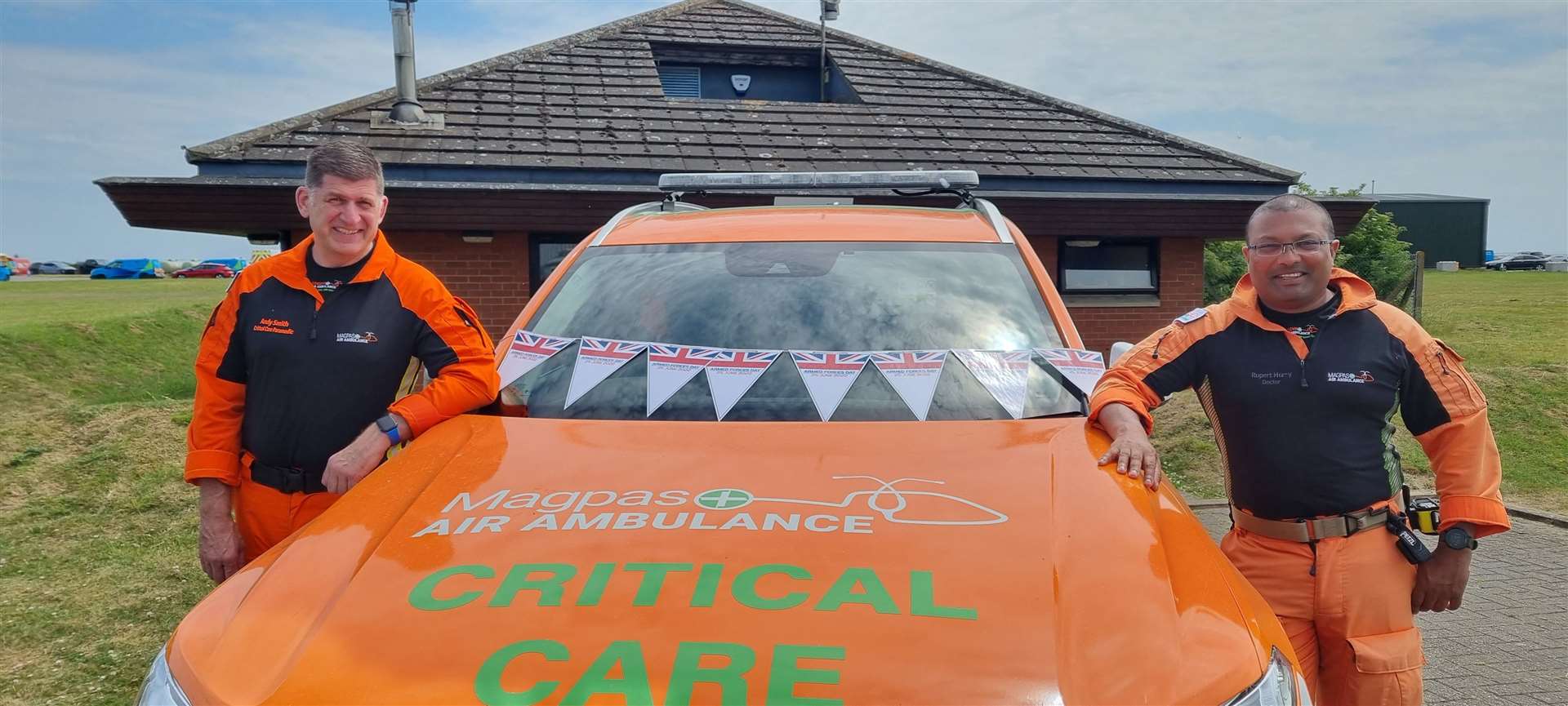 Magpas Air Ambulance medics, CCP Andy Smith and Dr Rupert Hurry (both part of the Armed Forces community), with a charity rapid response vehicle and Armed Forces Day bunting . (57526021)