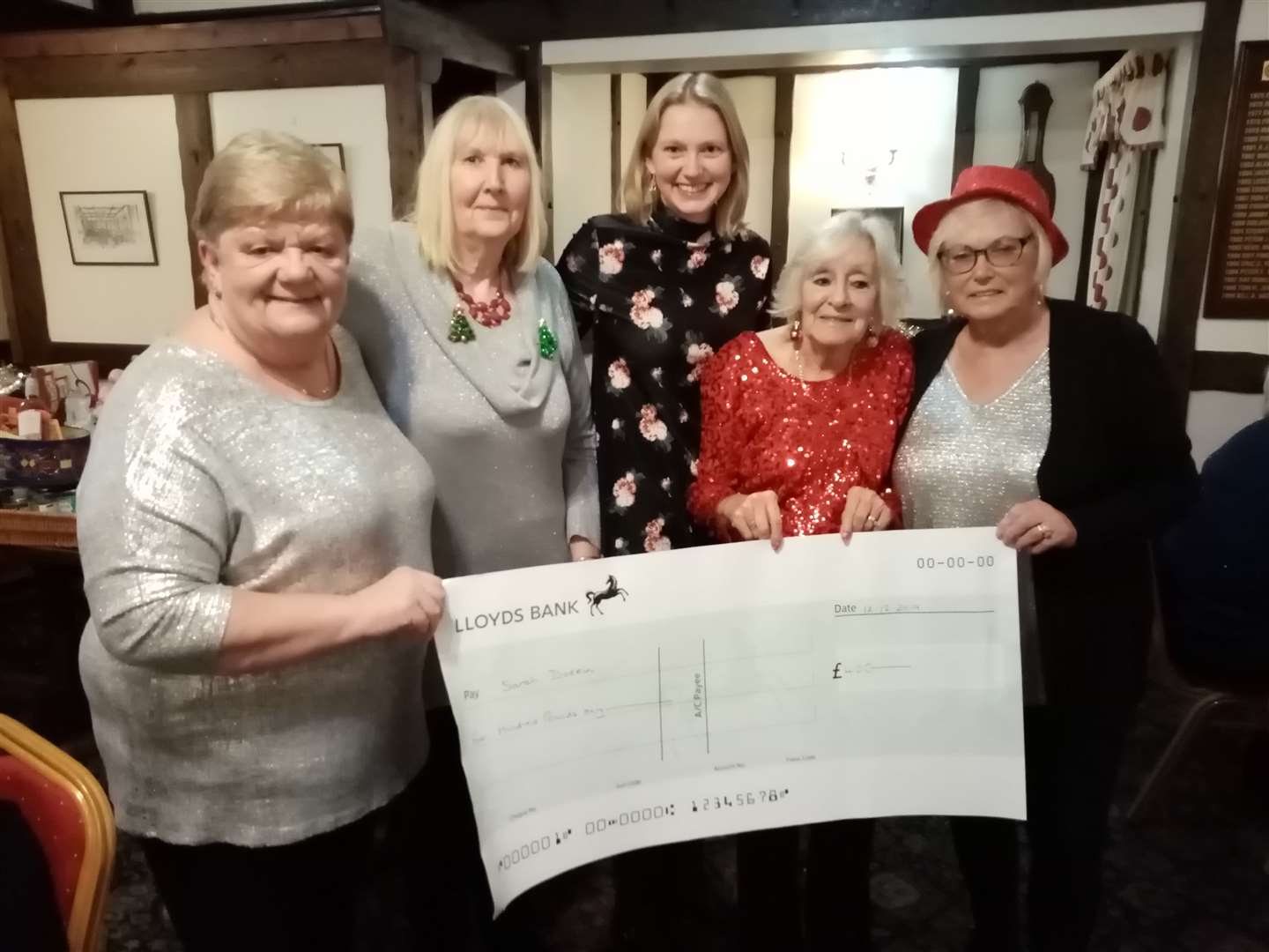 Sarah Dodkin (centre) receives the cheque from Maggie Mainwaring, Rossane Porter, Cheryl Doughty and Elizabeth McManus. (24487366)