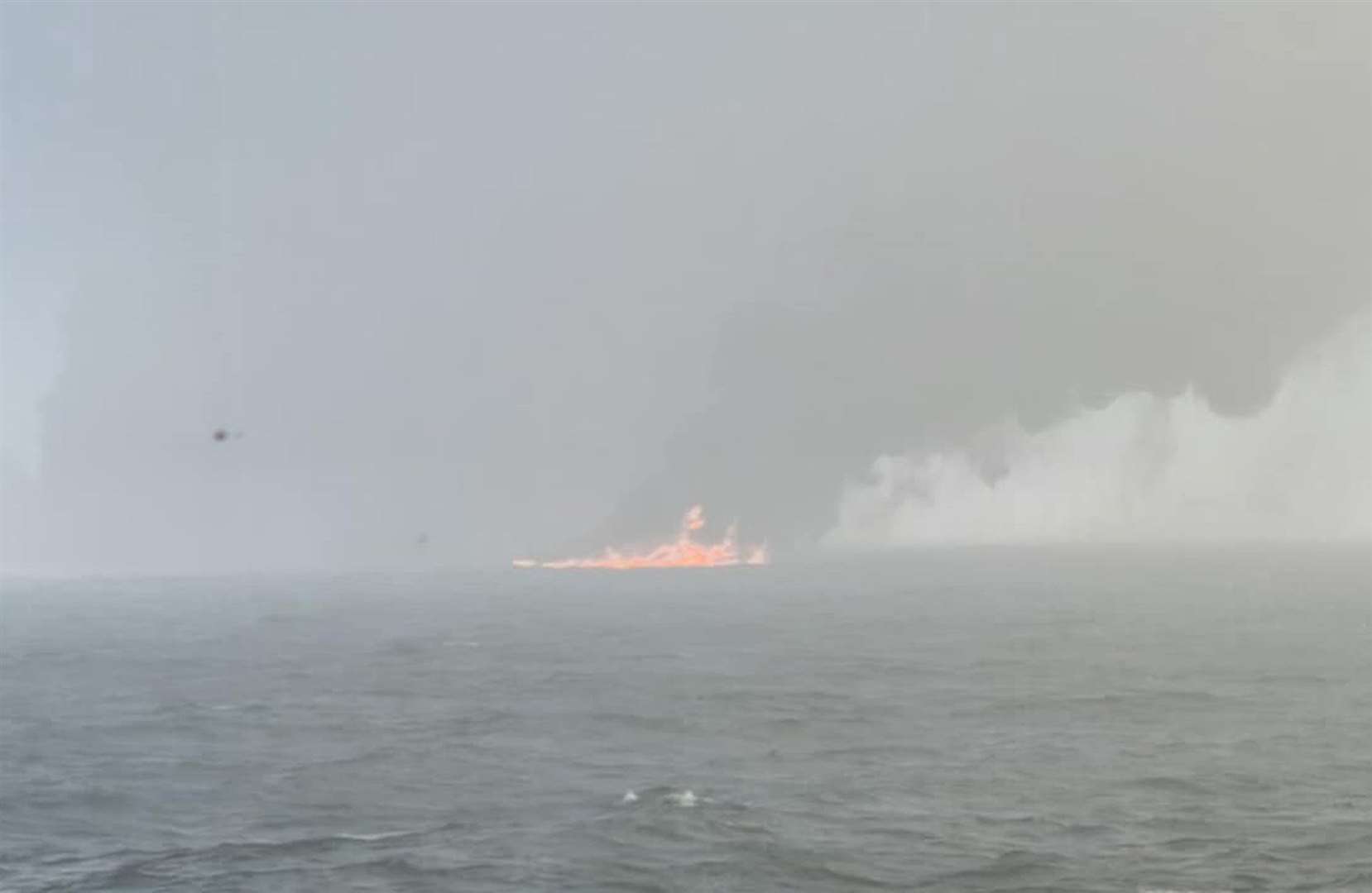Black smoke billowing into the air after the collision (Bartek Smialek/PA)