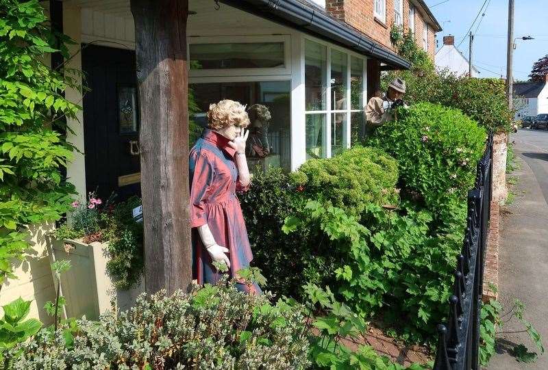 Scarecrow versions of Princess Diana and a photographer (Richard Hawkins/Urchfont Scarecrow Festival Charity/PA)