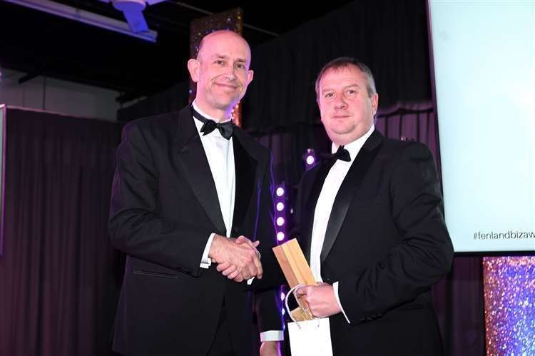 Gareth Edwards (left) received the Business of the Year Award on behalf of his firm Swann Edwards Architects from Iain Grimes of Fraser Dawbarns.